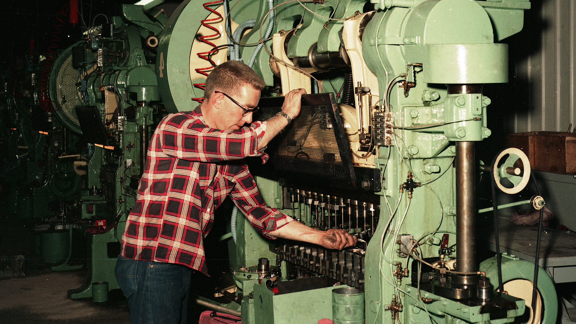 Hornady worker at bullet press