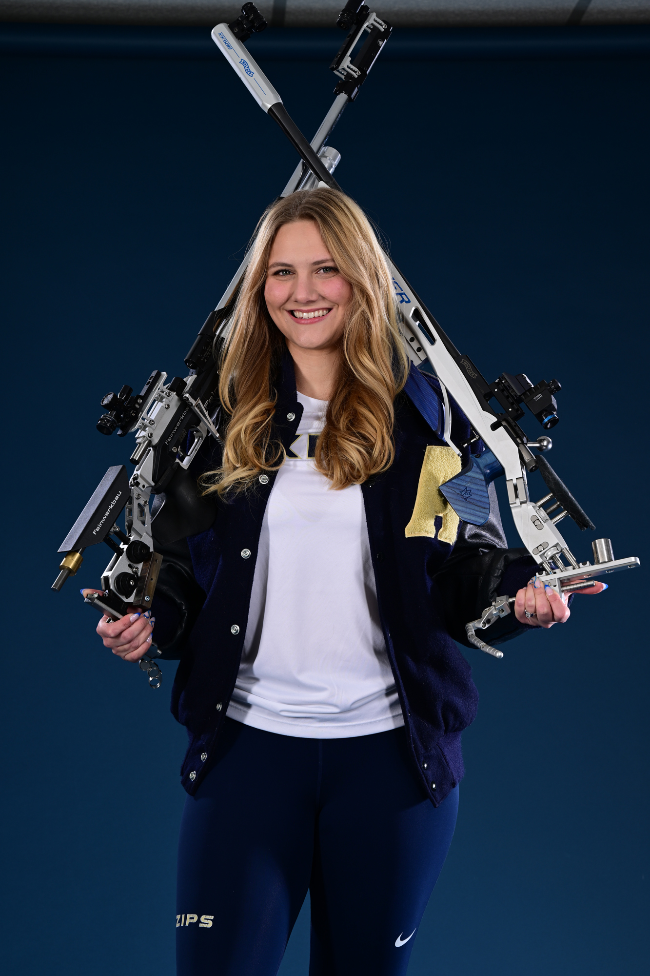 Erin Schnupp with rifles